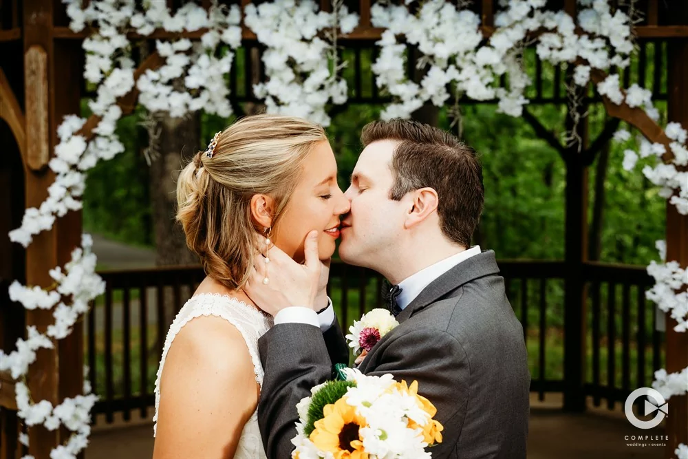 Complete Weddings + Events photography, bride and groom portraits, bride and groom kissing