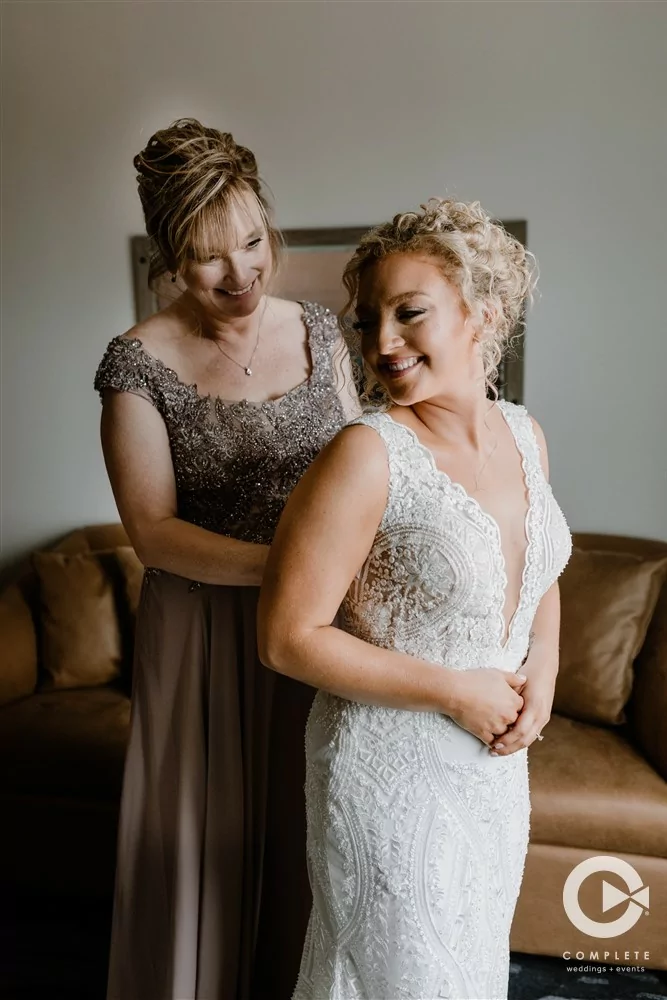 Complete Weddings + Events Photography, Bride, Mother of Bride, Bride getting into her wedding dress