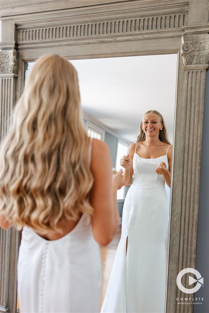 bride seeing herself in the dress