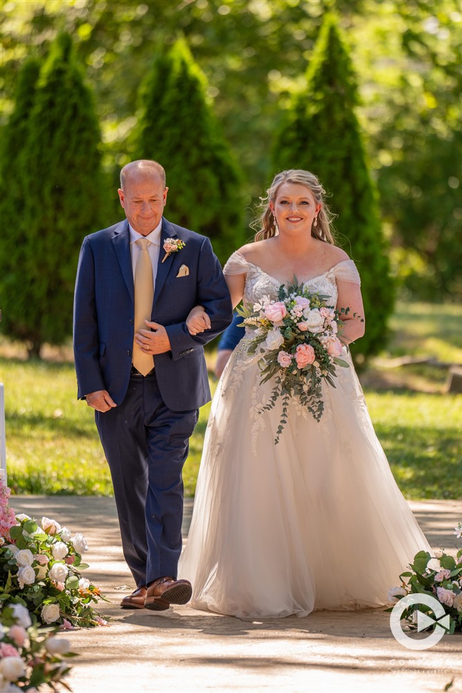 bride and father walking down the aisle