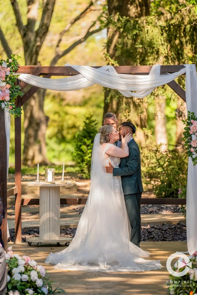 bride and groom kiss