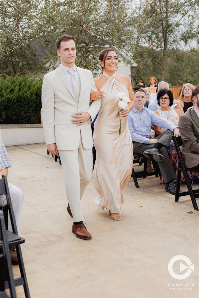 Wedding party walking down the aisle