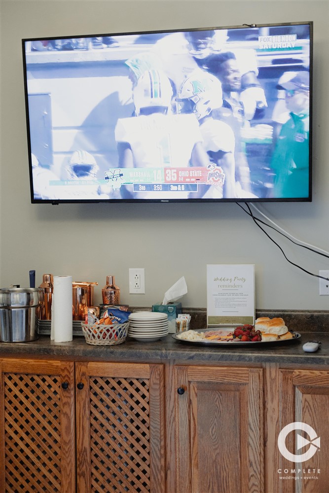 groomsmen watching football