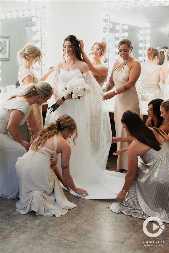 bridesmaid getting bride ready