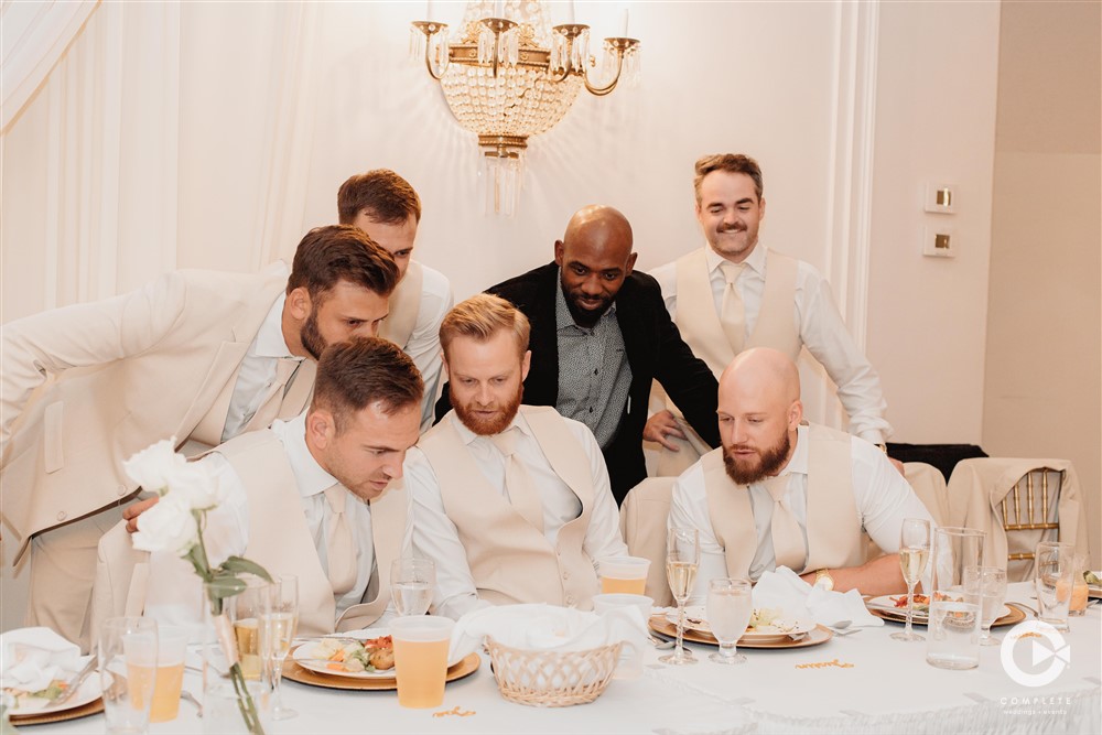 groomsmen watching football