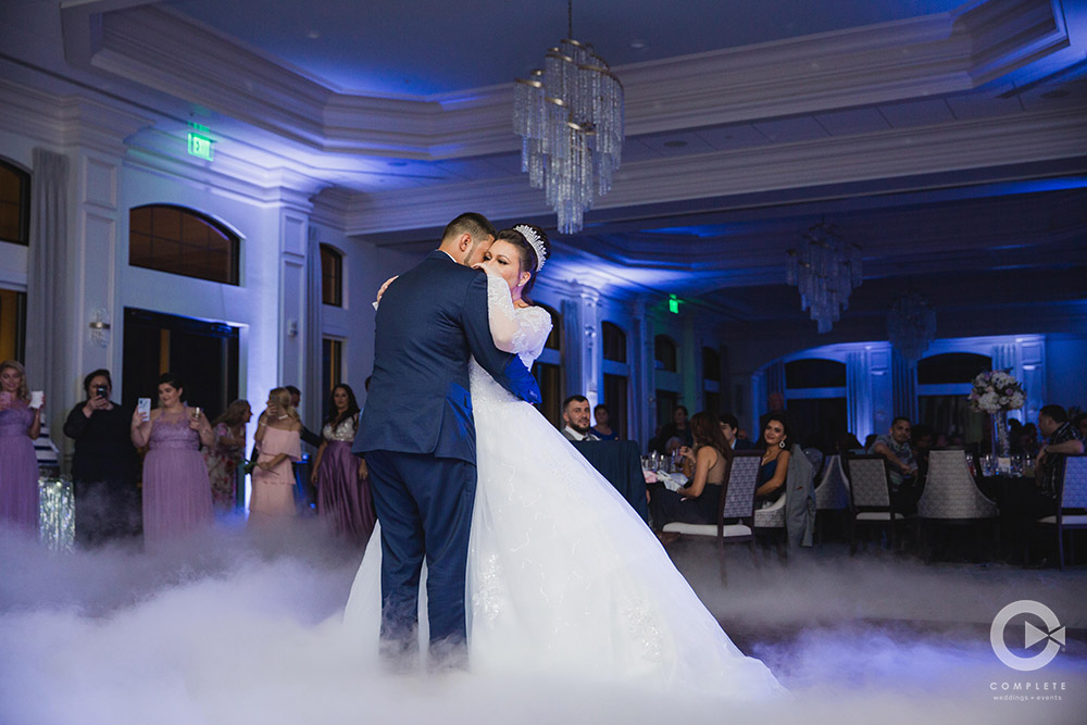 wedding dancing on a cloud with blue uprights