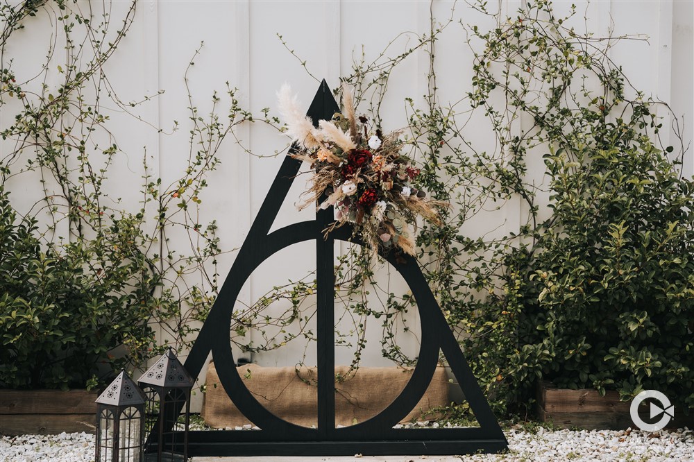 Harry Potter wedding backdrop at an outdoor wedding ceremony at The Edison Barn.