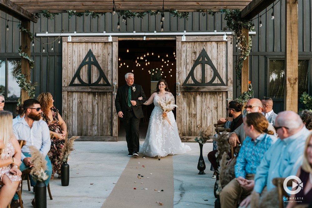 Harry Potter outdoor wedding ceremony at The Edison Barn in Dade City, FL.