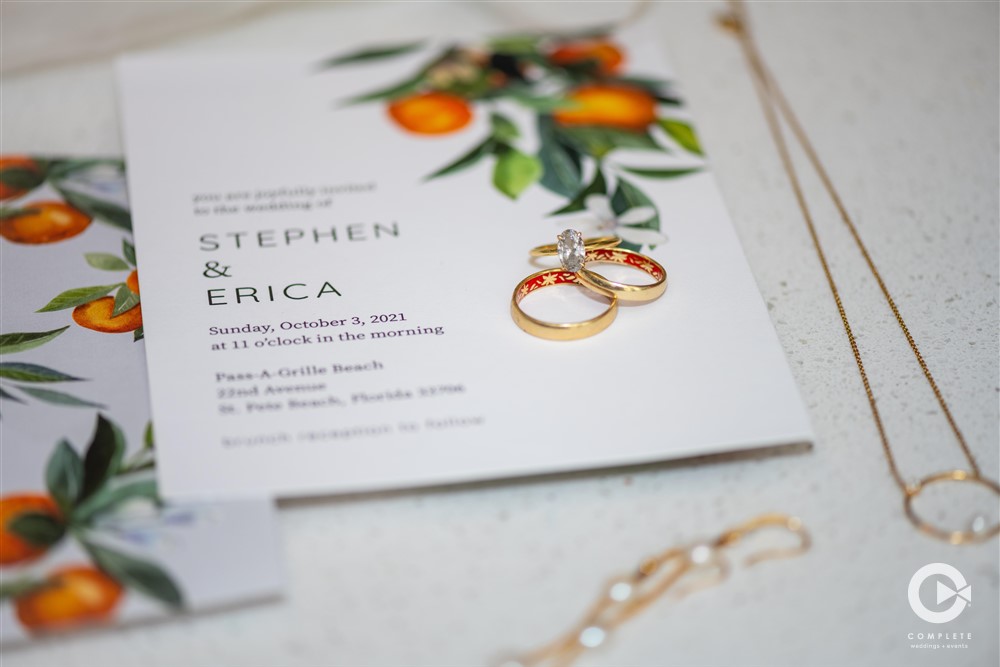 Tampa Bay wedding invitation and wedding rings.