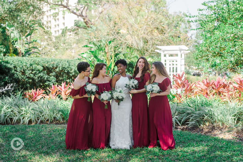Bride with Bridesmaids on lawn with bouquets