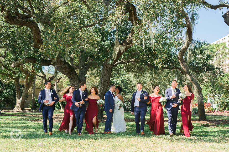 Newlyweds with entire bridal party on lawn under tree with spanish moss