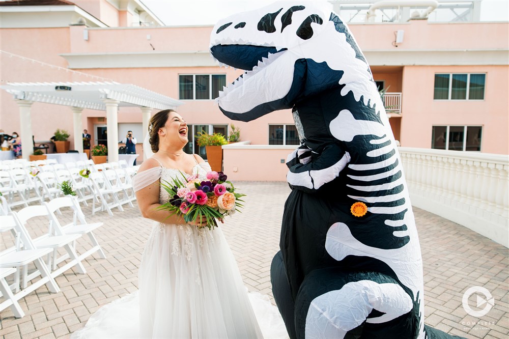 The groom dressed as a dinosaur during first look at the Glam Aloha Hyatt Clearwater Wedding Ceremony on The Sky Terrace