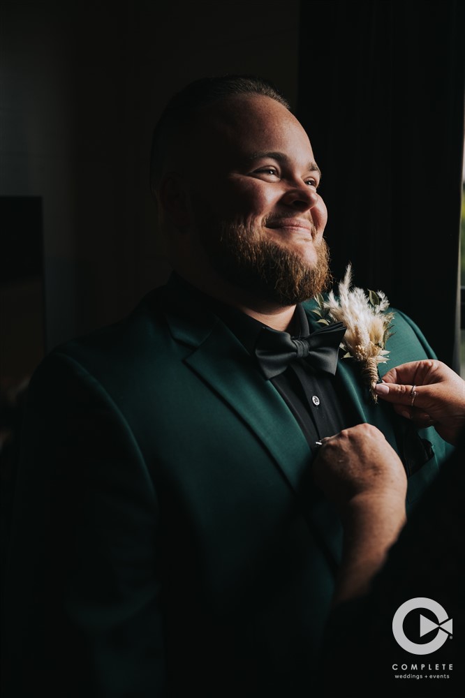 Smiling groom to be pre-ceremony