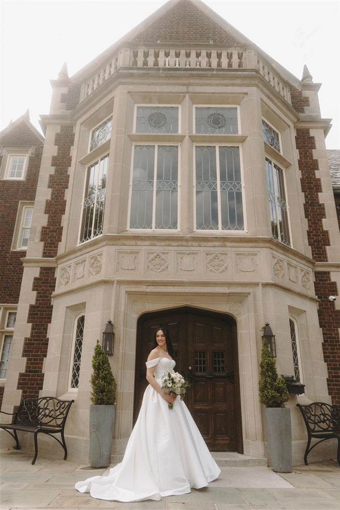 Bride standing in front of Harwelden Mansion