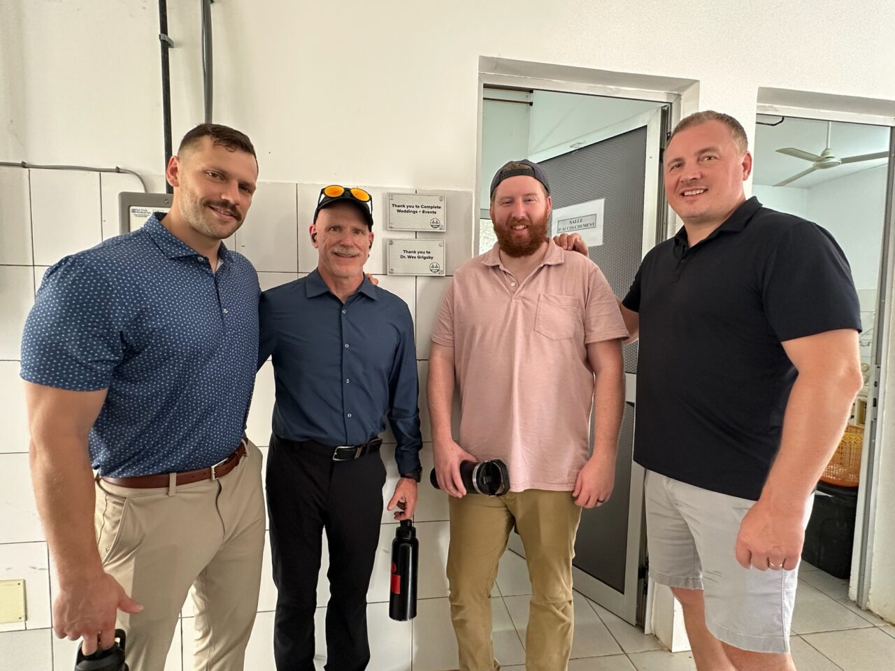 Ryan and Complete standing in medical facility africa