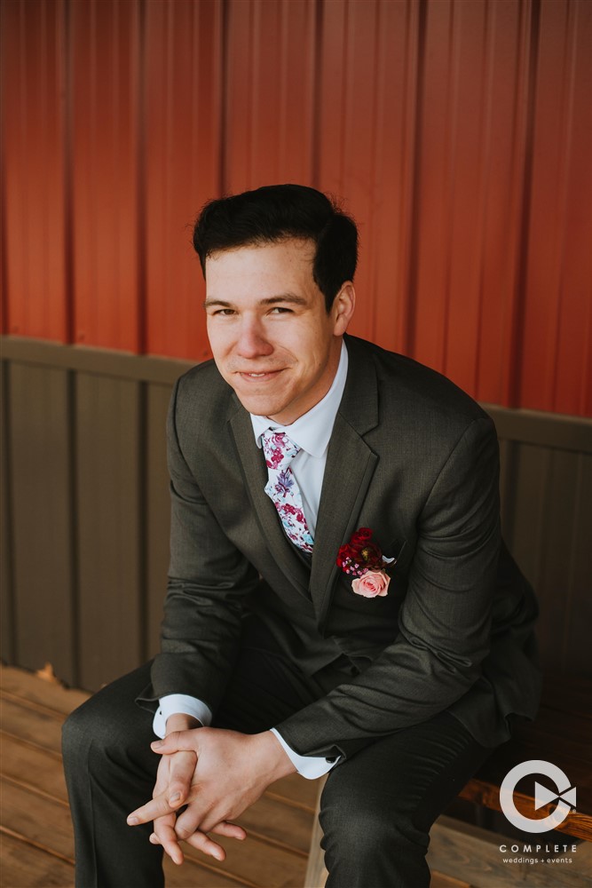 groom in colorful tie