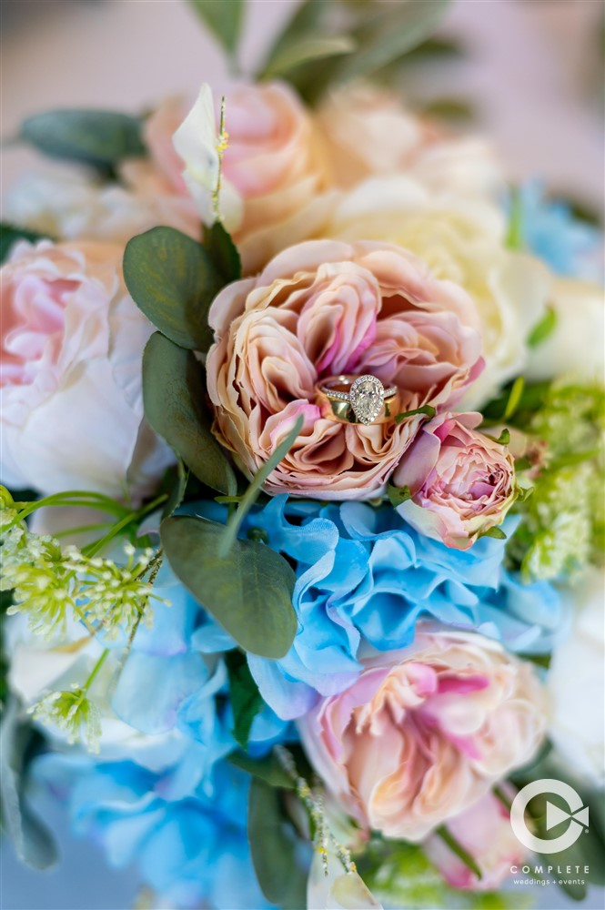 bouquet of pink, blue, green, and white roses