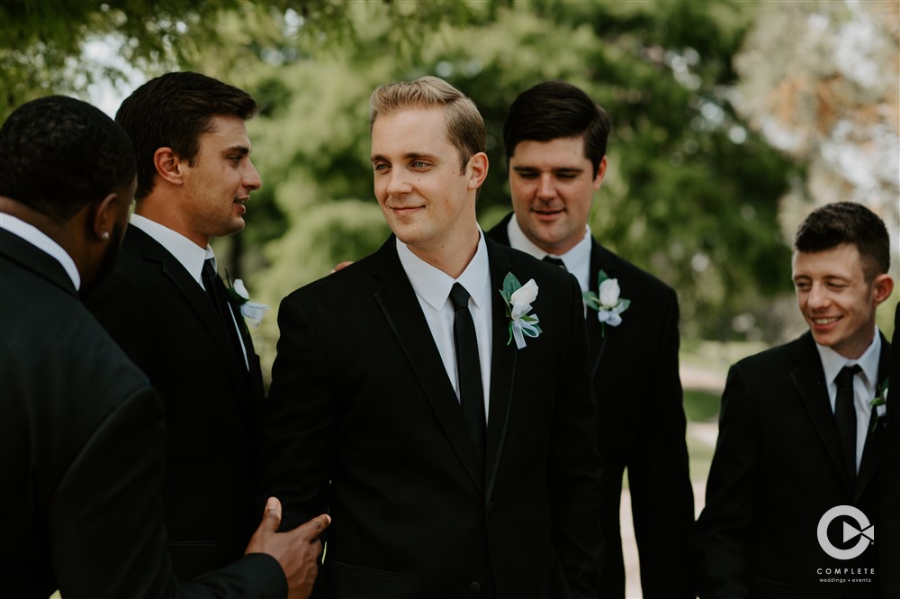 groomsmen in black and white suit