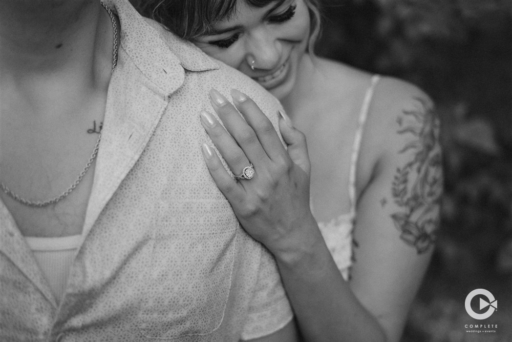 Black and white couple with engagement ring