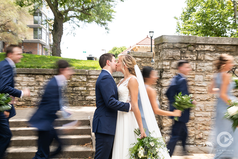 navy blue groom kissing bride