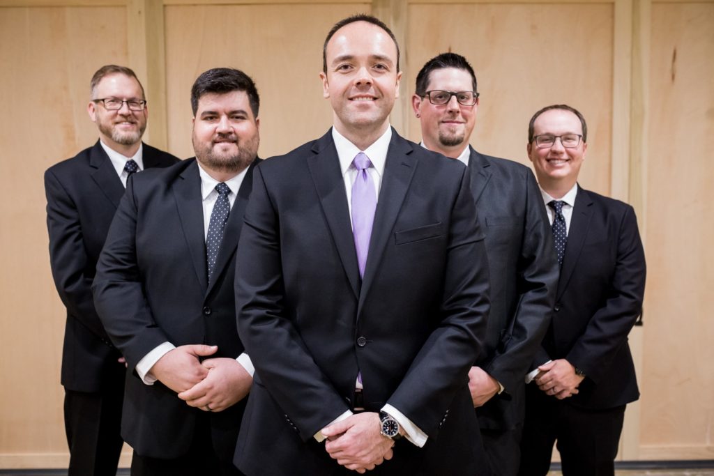 Groomsmen in purple ties