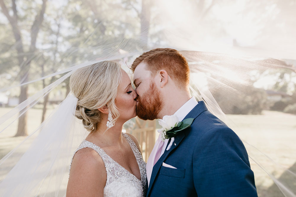 Bride Groom Kiss under Veil