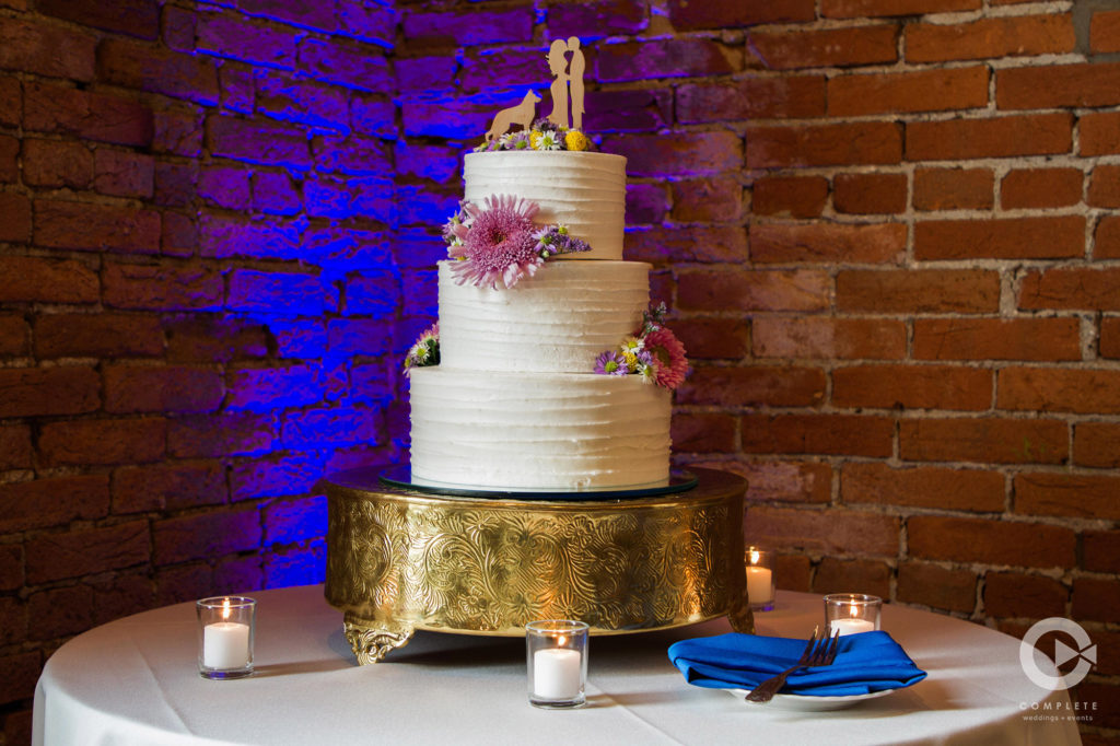 Wedding Cake table with purple Uplighting