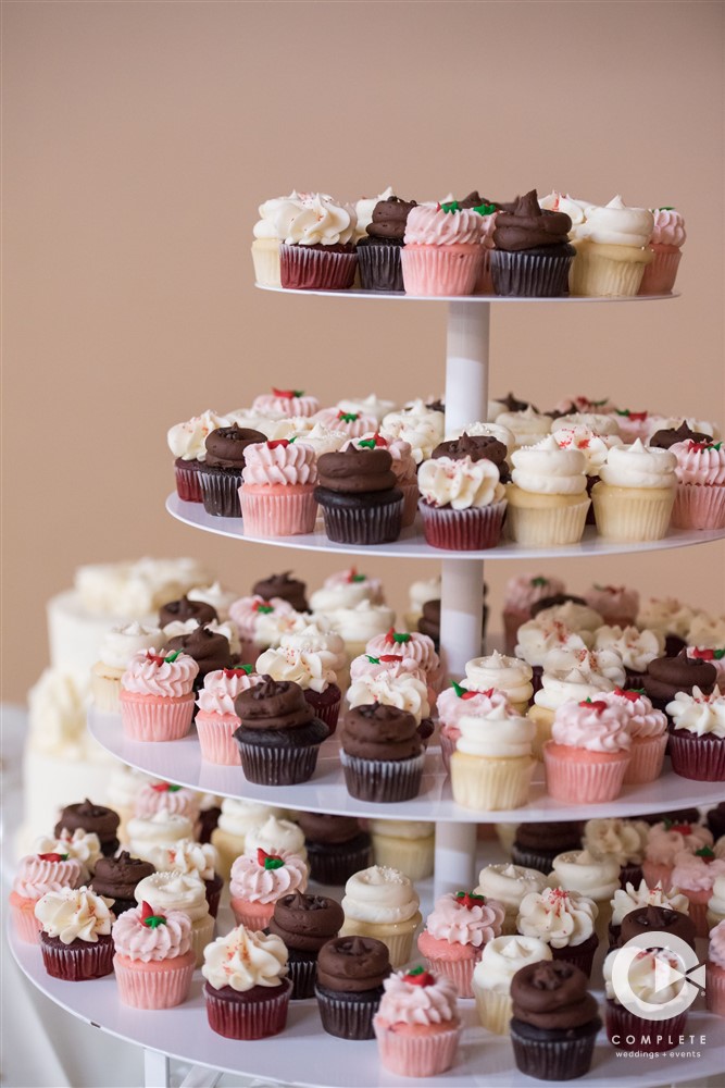 cupcake display with chocolate strawberry and vanilla