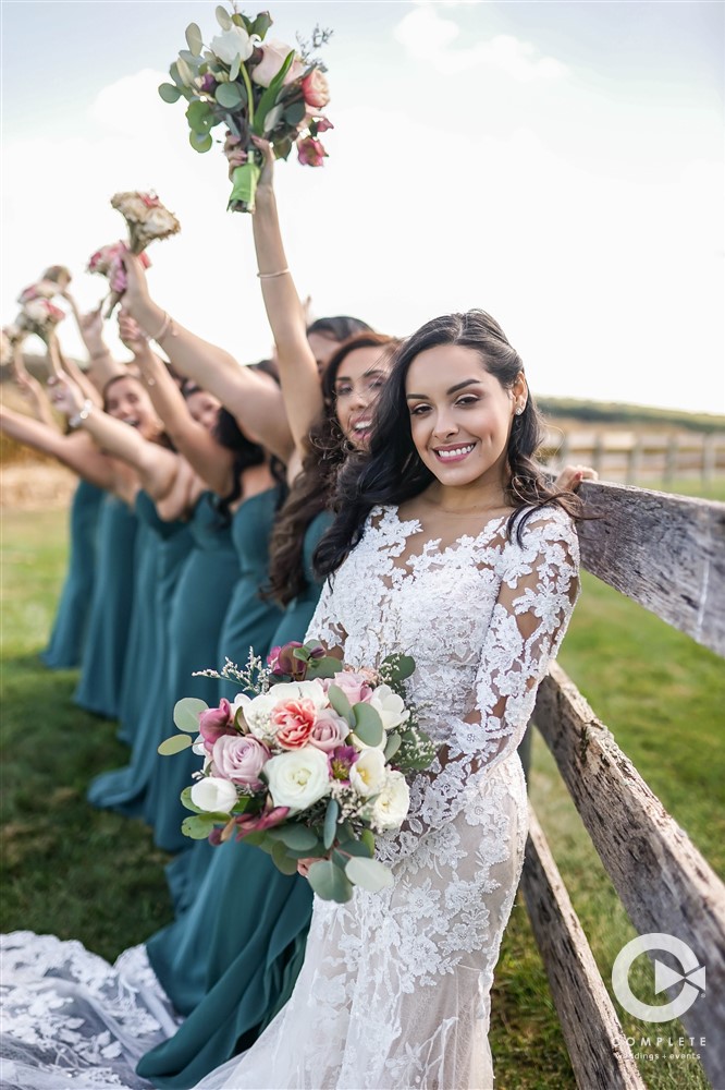 wedding party in green with pink flowers