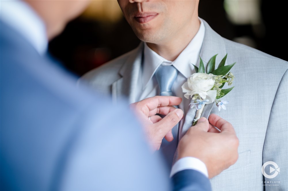 boutonnière, tie and accessories for the Groom