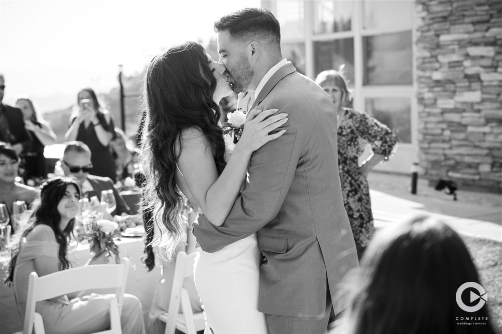 bride and groom kiss