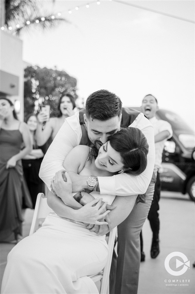 bride and groom hug