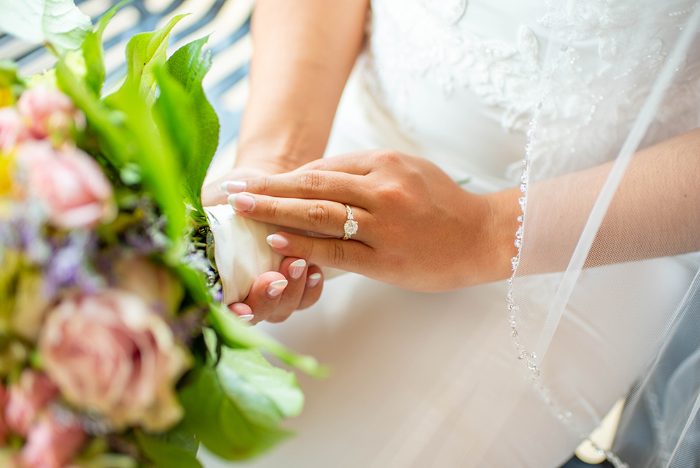 Neutral wedding day nails with pointed tips