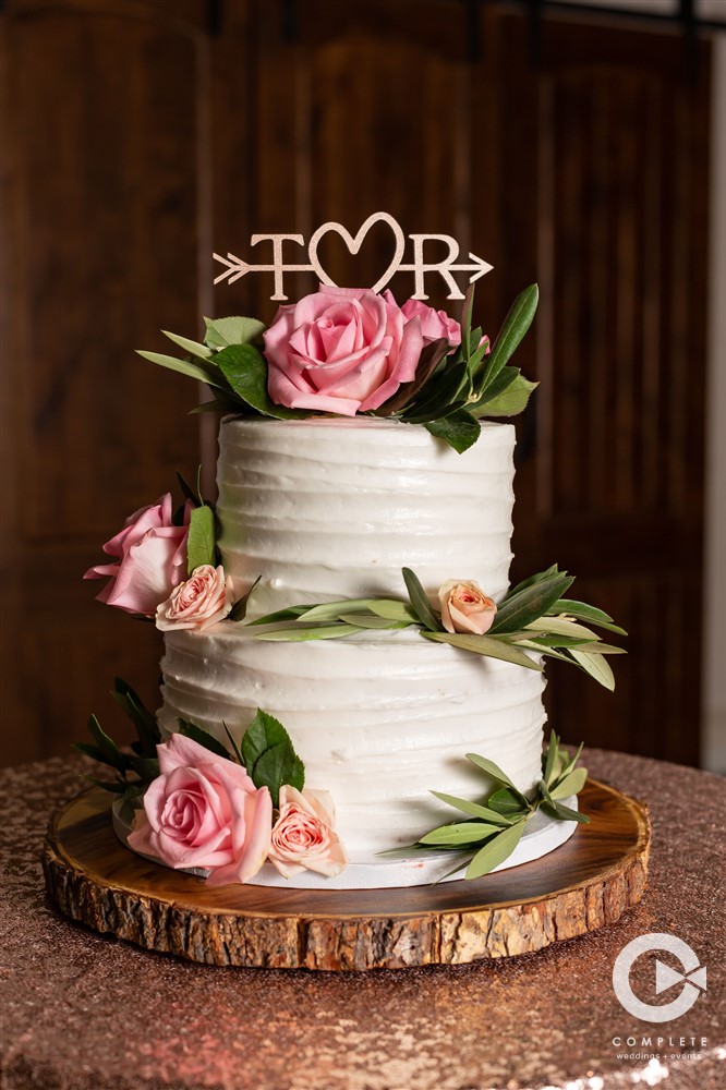 pink flowers on cake and sequin tablecloth